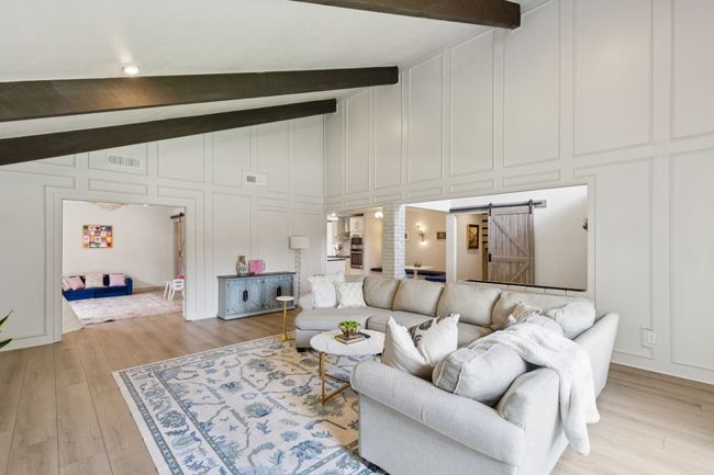 View into formal dining currently being used as family playroom, but does feature a half bath | Image 5