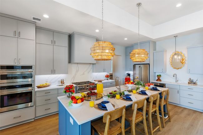 Kitchen featuring MSI Calacatta Leon Quartz counters. | Image 11