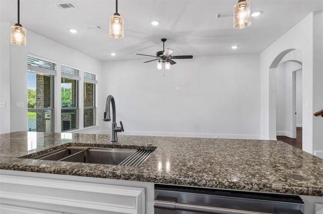 Kitchen island overlooking family room | Image 8