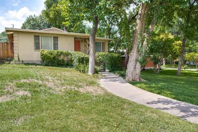 Front of building with mature trees and well maintained landscaping | Image 2