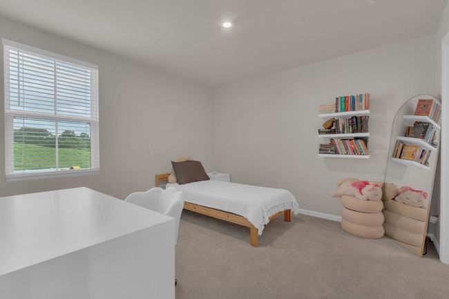 This charming upstairs bedroom (#3) not only offers a cozy atmosphere but also boasts a generous walk-in closet, providing ample space. | Image 35