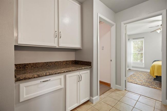 2nd floor landing with a homework station, 3 bedrooms each with walk-in closets, and a full jack and jill style bathroom. | Image 22