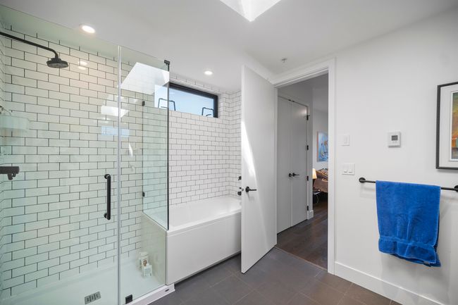 Full bathroom featuring ensuite bath, a shower stall, a bathtub, tile patterned floors, and recessed lighting | Image 14