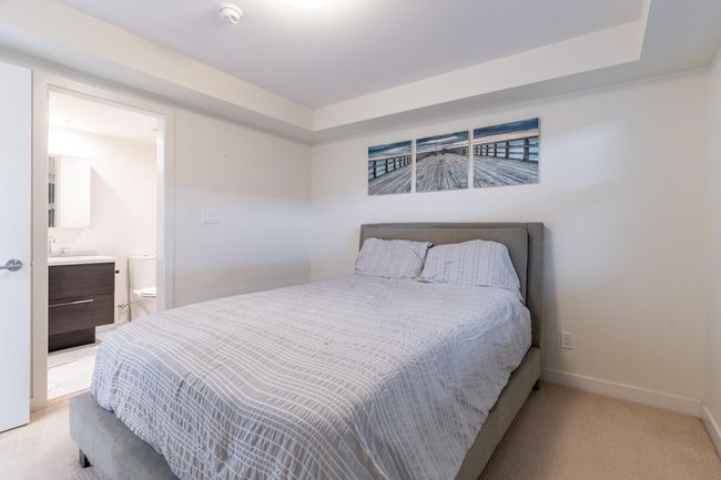 Carpeted bedroom with a closet | Image 16