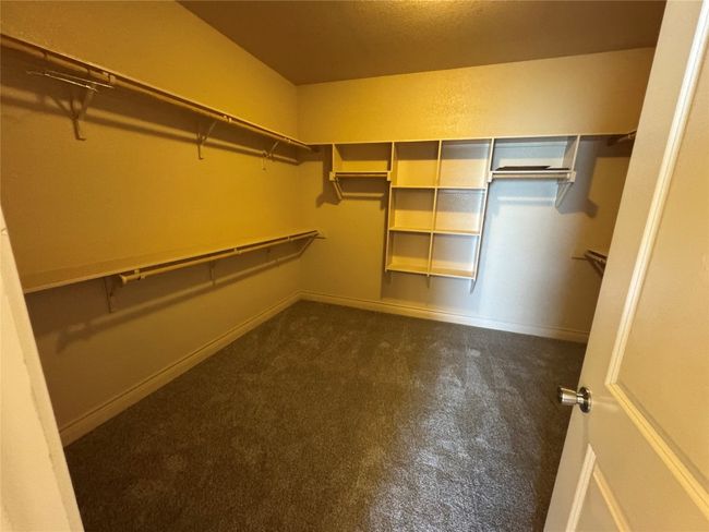 View of walk in closet | Image 11