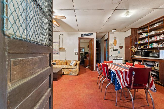 Dining area with carpet flooring | Image 23