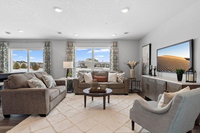 Spacious living room of this open concept main floor! Photo is of model home. Colors and options may vary. Ask Sales Agent for details. | Image 10