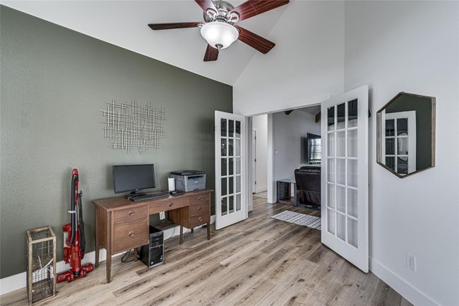 Office area with french doors and LVP flooring. | Image 11