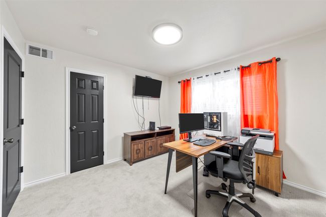Office with baseboards, visible vents, and light colored carpet | Image 35