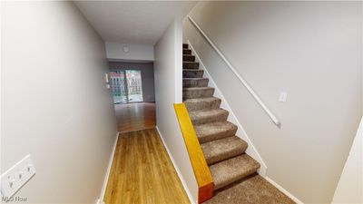 Staircase featuring hardwood / wood-style floors | Image 2