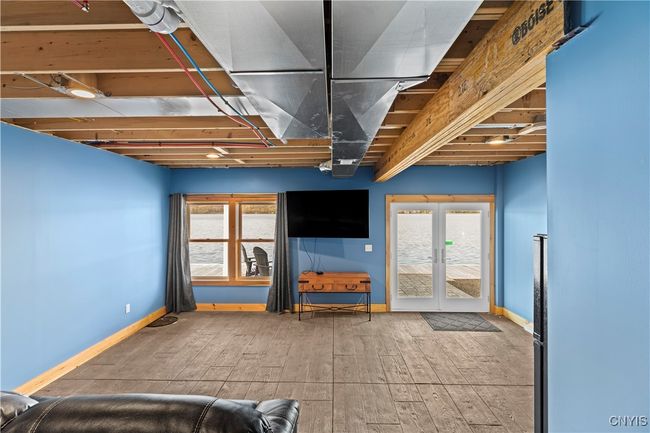 Lower level with theatre room with waterfront view | Image 25