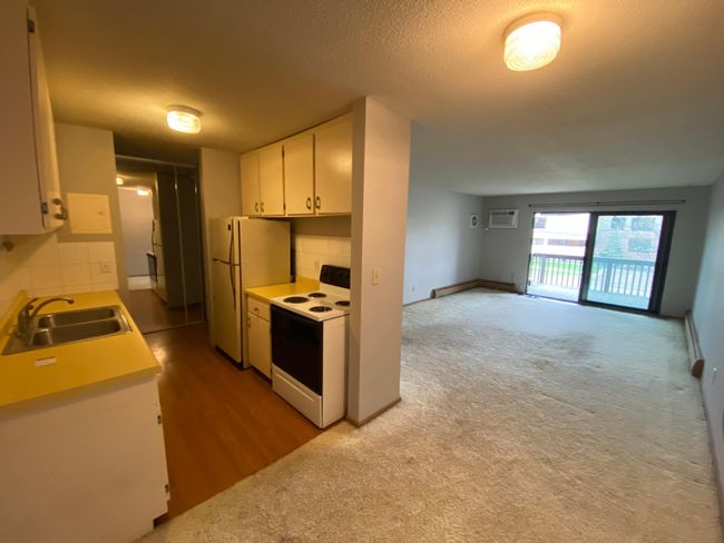 Livingroom - Seller will provide buyer with $1, 000 credit to update the floor! | Image 5