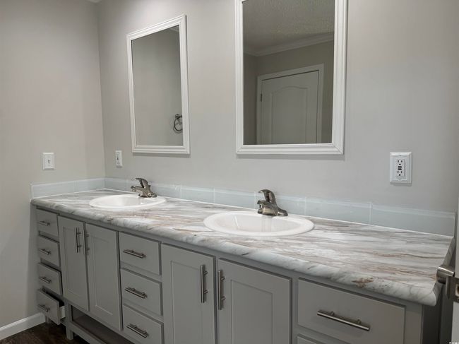 Full bathroom with double vanity and ornamental molding | Image 22