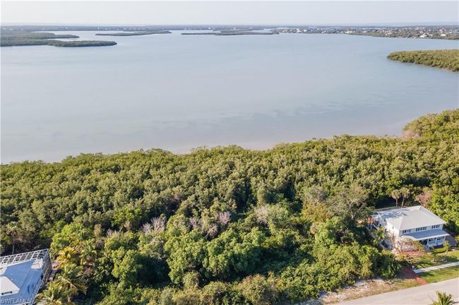 Bird's eye view with a water view and a wooded view | Image 10