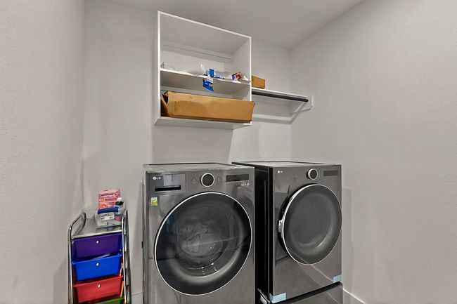Clothes washing area featuring separate washer and dryer and baseboards | Image 36
