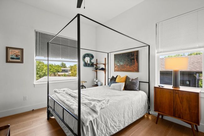 Bedroom with wood finished floors and baseboards | Image 21