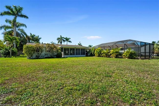 View of yard featuring glass enclosure | Image 21