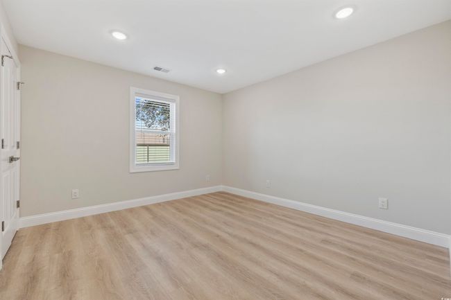 Spare room with light wood-style flooring, baseboards, and recessed lighting | Image 21