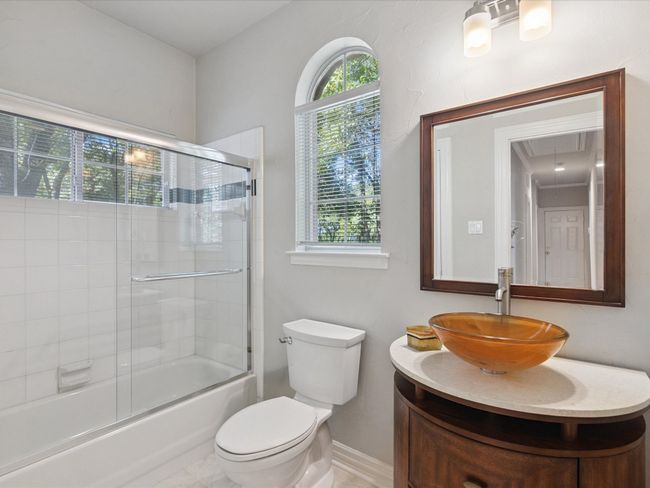 Full bath with vanity and bath / shower combo with glass door | Image 17