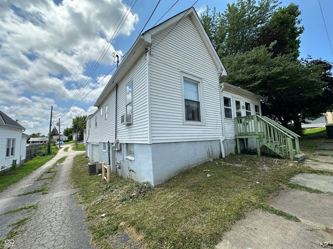 view of home's exterior with driveway and cooling unit | Image 27