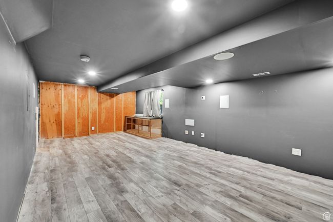 Finished basement featuring visible vents and wood finished floors | Image 36