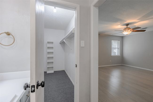 Spacious closet featuring a ceiling fan | Image 17