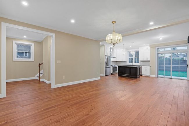 Warmed by recessed lighting and beautiful chandelier. | Image 9