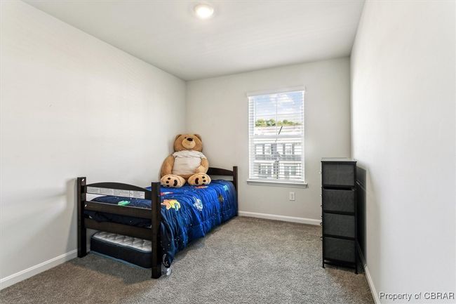 Bedroom with baseboards and carpet flooring | Image 21