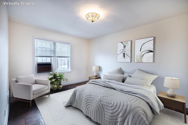 Bedroom with baseboards and wood finished floors | Image 12
