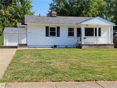 View of front of property with a front yard and covered porch | Image 1