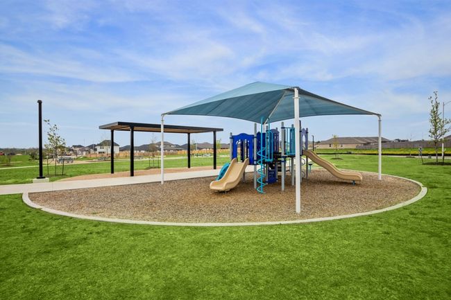 Community playground featuring a lawn | Image 36