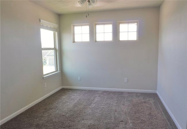 Spare room featuring healthy amount of natural light and carpet flooring | Image 14