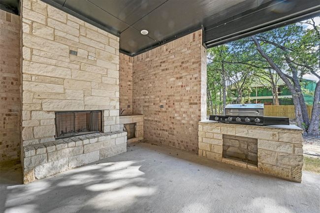 View of patio featuring area for grilling | Image 16