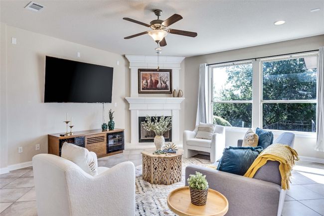 Living room featuring multiple large windows with greenbelt view | Image 8