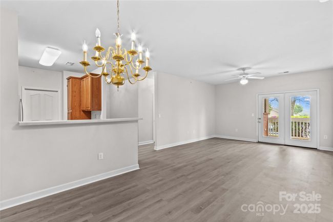 Open Concept Dining, Living Kitchen with LVP Flooring throughout. | Image 11