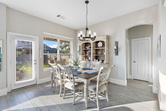 Bright and welcoming, the breakfast room offers peaceful garden views—the perfect spot to start your day with coffee or gather for family meals. | Image 15