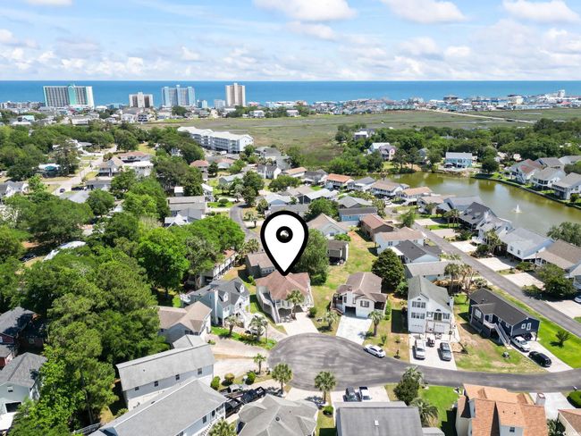 Aerial perspective of suburban area with a nearby body of water | Image 9