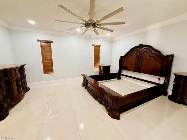 Bedroom featuring ornamental molding, recessed lighting, ceiling fan, and light tile patterned floors | Image 16