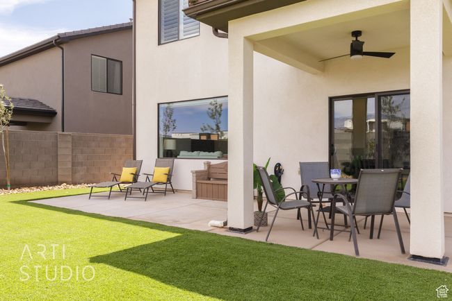View of patio / terrace with fence and ceiling fan | Image 38