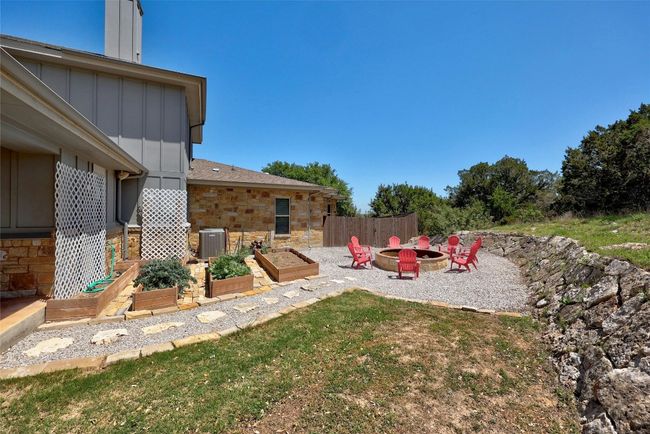 Make the MOST of this land and space, you can enjoy roasting marshmallows or telling stories around the stone firepit. Raised garden beds allow for growing your own vegetables with ease! | Image 33