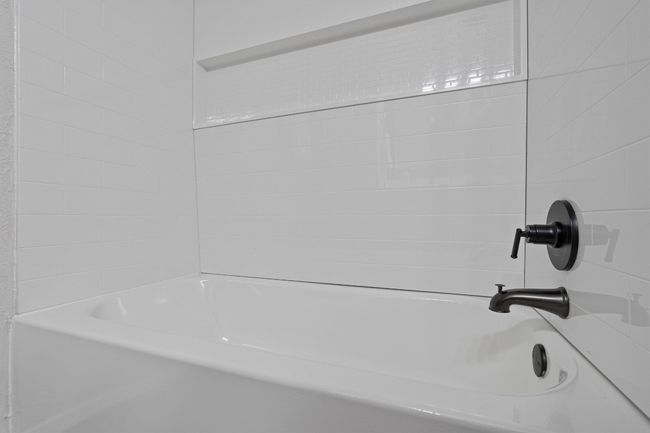 Bathroom view of shower / washtub combination | Image 15