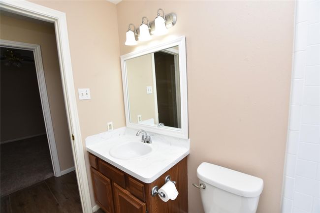 Whether hosting overnight guests or providing a convenient space for family members, this guest bathroom offers a welcoming and functional environment that meets a variety of needs. | Image 25