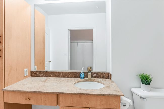 Bathroom with toilet and vanity | Image 21