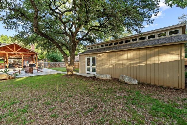 Fenced backyard with french doors and a patio area | Image 34