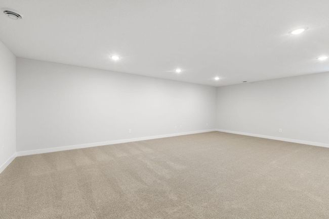 With its generous size, this FINISHED basement provides a unmatched canvas for seating and a media setup - the perfect spot to unwind, watch movies, or gather with friends and family in a comfortable, private setting. | Image 32