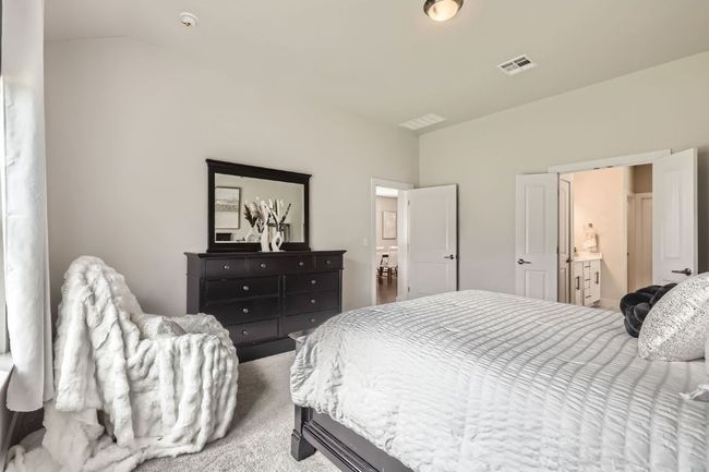 Bedroom featuring carpet floors and lofted ceiling | Image 15
