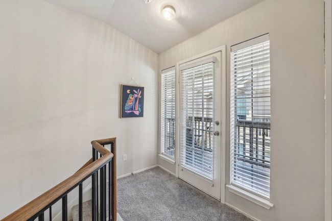 Split-Level Style – Upstairs living offers privacy and quiet away from the entry. | Image 5
