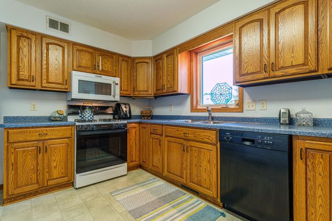 Well laid out kitchen features plenty of storage space | Image 5