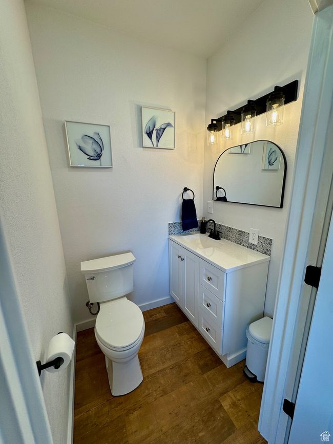 Bathroom with toilet, wood-type floors, vanity | Image 13