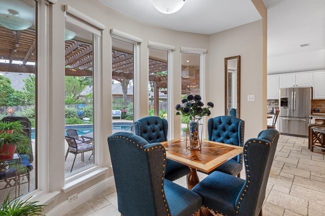 Eat in kitchen dining overlooking the beautiful pool | Image 17
